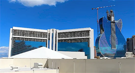 Visible construction progress on both the the Hard Rock guitar tower and former Mirage hotel tower